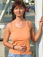 Slim mature candy gets naked in a public place