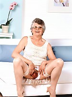 Mature model spreading her fat sagged thighs wide to expose her juicy looking hirsute cunt