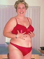 Horny mature pornstar taking off her clothes and playing with her huge plump knockers live