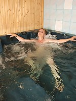 Horny mature slut playing alone in the bath and sauna