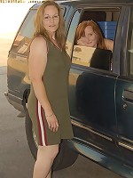 This mature slut gets fistfucked in a driving car