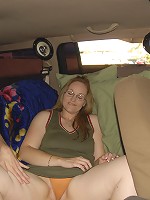 This mature slut gets fistfucked in a driving car