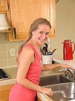 Anilos mom Sara James takes off her panties and plays her black vibrator in the kitchen
