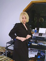 Blonde office MILF strips and spreads her ivory legs