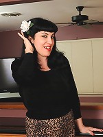 Busty and elegant Caudine from AllOver30 spreads wide in the kitchen