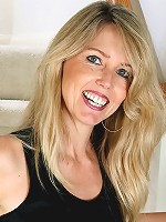 Blonde MILF Ginger B spreads her ass wide for you on the stairs