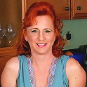 All natural red headed MILF shows off her sexy feet and hairy pussy