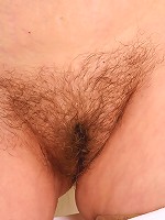 63 year old Hannah plays with her furry bush at home