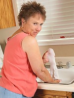 64 year old Sandra D washes more than just the dishes in this one