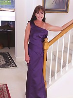 Horny older babe Cynthia Davis peels off purple dress.