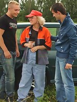 Two dudes fuck a naughty granny outdoors and she takes all the cock she can get